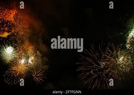 Colored night explosions in black sky. Fireworks on May 9, Victory Day Stock Photo