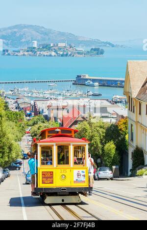 Powell-Hyde line cable car with Alcatraz Island in the background, San Francisco, California, United States of America, North America