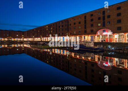 Reflected view at Christmas of The Royal Albert Dock and Tate Museum, Liverpool, Merseyside, England, United Kingdom, Europe