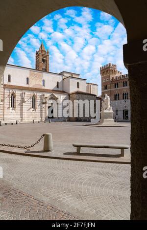 San Lorenzo Cathedral (Duomo) and Canapone monument statue viewed from the old arcade, Grosseto, Tuscany, Italy, Europe Stock Photo