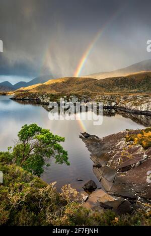 Rainbow and rain clouds over Upper Lake, Killarney National Park, County Kerry, Munster, Republic of Ireland, Europe Stock Photo