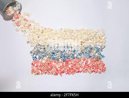 Russian flag made of pop corns. Colorful flat lay shot on a white background. Abstract concept. Nationality ideas. Stock Photo