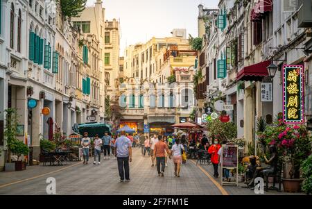 Haikou China , 21 March 2021 : Qilou old street aka Zhongshan road with ancient sotto portico buildings and dramatic light in Haikou old town Hainan C Stock Photo