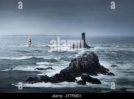 View of the ocean at Pointe du Raz with two lighthouses, Phare de la Vieille and Tourelle de la Plate (Petite Vieille), in the sea and rocks, France Stock Photo