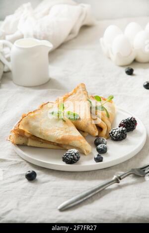 Traditional Russian tiny pancakes. Top view. Pancake week. Shrovetide. Close up. Tasty breakfast. Stock Photo