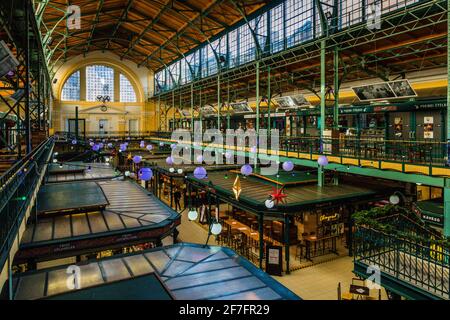 The culinary offer in the Hold Street Market extends over two levels. In contrast to the concept of the food courts, in which vendors share all the seating for their guests, in the Hold Street Market each restaurateur has his own seating area Stock Photo