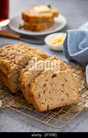 Beer bread on a cooling rack sliced and ready to eat Stock Photo