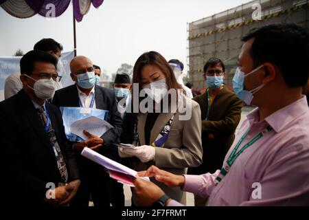 Kathmandu. 7th Apr, 2021. Chinese Ambassador to Nepal Hou Yanqi (C) discusses vaccination with local officials at a hospital in Kathmandu, Nepal on April 7, 2021. Nepal on Wednesday started administering the COVID-19 vaccines donated by China amid resurging COVID-19 cases. Credit: Sulav Shrestha/Xinhua/Alamy Live News Stock Photo