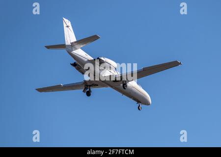 Business jet landing at the airport Stock Photo