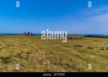 Ramblers making their way towards the trig point on Hergest Ridge Kington Herefordshire UK. March 2021 Stock Photo