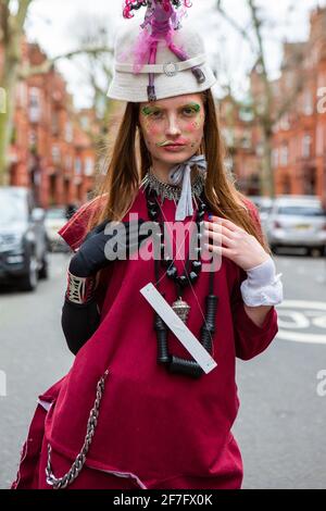 A model showcases Pierre Garroudi's collection during the designer's flash mob fashion show at Sloane Square in London, UK