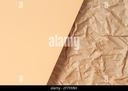 Abstract geometric paper texture background. Blank beige color paper sheet over recycle crumpled brown paper background Stock Photo