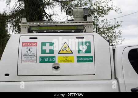 Aylesbury Vale, UK. 7th April, 2021. HS2 doing surveillance on members of the public again. Stop HS2 protesters locked themselves onto a big barrel this morning and blocked the road into the HS2 compound at Jones Hill Wood. HS2 activists are trying to stop HS2 from felling Jones Hill Wood which is ancient woodland where rare barbastelle bats roost. Thames Valley Police cut them out of the lockon and number of activists were arrested today. Natural England have granted a licence to HS2 to fell Jones Hill Wood despite the presence of rare bats. The High Speed Rail 2 is carving a huge scar of des Stock Photo