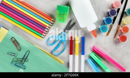 Overhead view of colorful school art supplies on a table Stock Photo