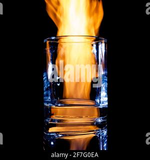 empty glass for strong alcohol on a black background Stock Photo