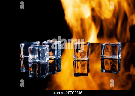 ice cubes on a black background in flames Stock Photo