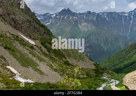 View of the river valley, the mountain range under the clouds and rocky slopes. Landscape, tinted. HDR foto