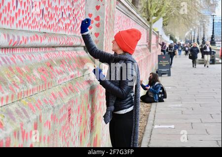 London. UK. Hearts continue to be added to the National Covid Memorial Wall at St. Thomas' Hospital Westminster, in memory of those who have died from coronavirus during the pandemic. Stock Photo