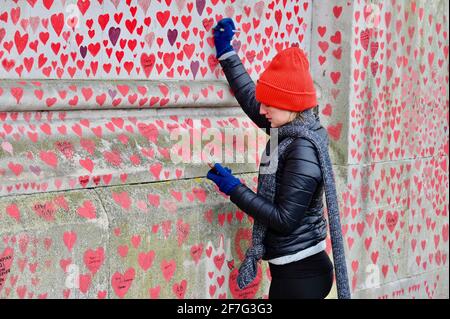 London. UK. Hearts continue to be added to the National Covid Memorial Wall at St. Thomas' Hospital Westminster, in memory of those who have died from coronavirus during the pandemic. Stock Photo