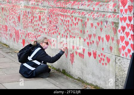 London. UK. Hearts continue to be added to the National Covid Memorial Wall at St. Thomas' Hospital Westminster, in memory of those who have died from coronavirus during the pandemic. Stock Photo