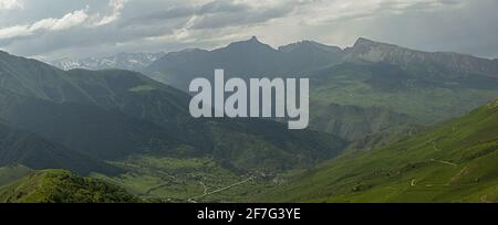 amazing view of mountain peaks, meadows and valleys. Panorama. High resolution. Toned. Stock Photo