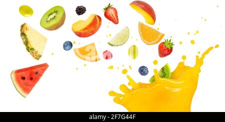 fruit cocktail falling into splashing yellow juice Stock Photo