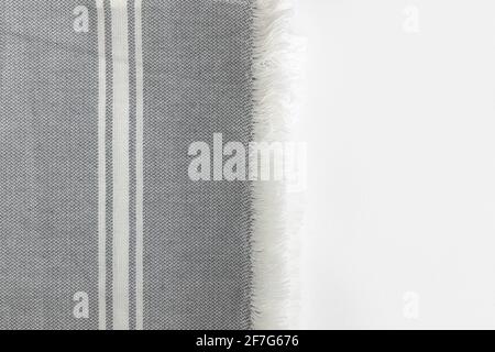 Folded grey cotton napkin isolated on white background with copy space. Top view Stock Photo