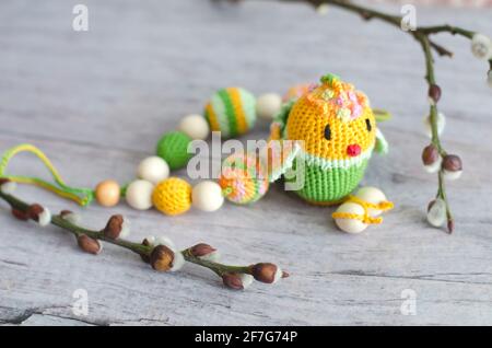 Necklace made from knitted beads and toys for the baby sitting in a sling. Knitted beads. Sling necklace. Stock Photo