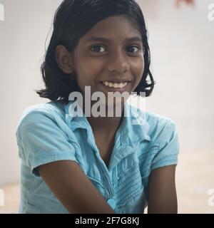 Varanasi, India. 10-16-2019. Portrait of a smiling girl looking at the camera during school in Varanasi. Stock Photo