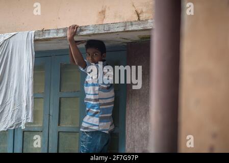 Varanasi, India. 10-16-2019. Portrait of a male adolescent looking at the camera inside the school premises in Varanasi. Stock Photo