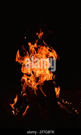 real and hot flames are burning on a black background Stock Photo - Alamy