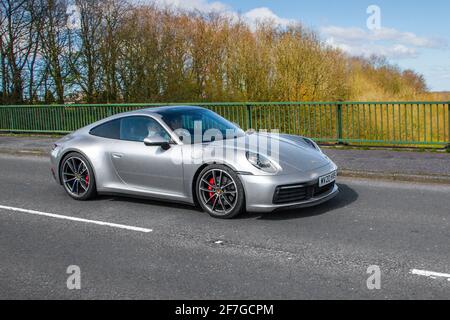 2020 Porsche 911 Carrera 4S S-A coupe; vehicular traffic, moving vehicles, cars, vehicle driving on UK roads, motors, motoring on the M6 highway English motorway road network Stock Photo