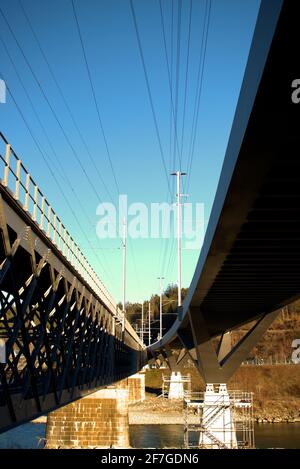 Below a bridge across the rhine river in Tamins in Switzerland 20.2.2021 Stock Photo