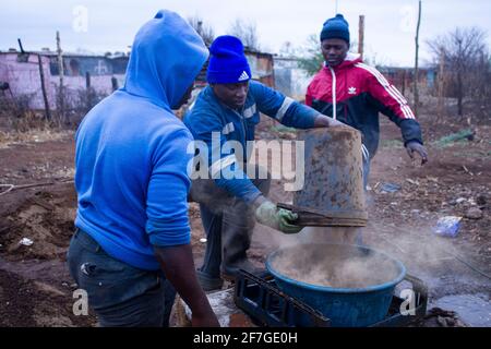 Miners working in the the process of sieving the mineral-rich dust can last a few hours worker in the township of Xawela, Carletonville near Johannesburg, South Africa on September 2nd, 2020. (Photo by Manash Das/Sipa USA) Credit: Sipa USA/Alamy Live News Stock Photo