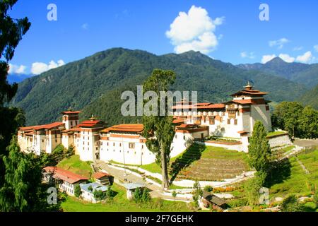 Dakar Dzong, monastery fortress in the Kingdom of Bhutan Himalaya Asia View into the valley with river sunbeams green view panorama Sanctuary Unesco Stock Photo