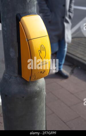 Traffic light button in Cologne Germany. Push it and green light comes Stock Photo
