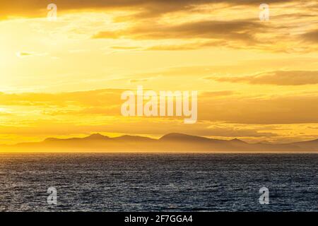 A sunset over the NW Pacific coast near Prince of Wales Island, Alaska, USA - Viewed from a cruise ship sailing the Inside Passage Stock Photo