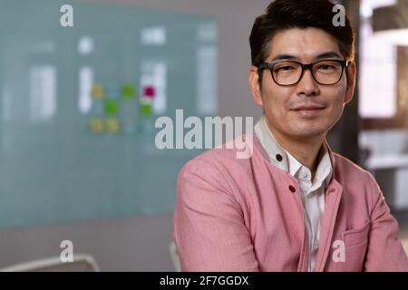 Portrait of stylish asian businessman smiling to camera Stock Photo