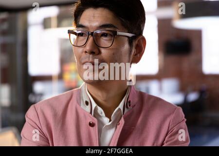 Portrait of confident stylish asian businessman looking to side Stock Photo