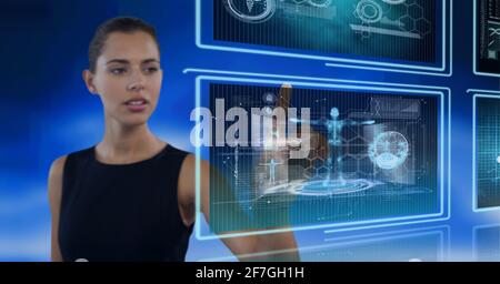 Composition of data processing over caucasian woman in background Stock Photo