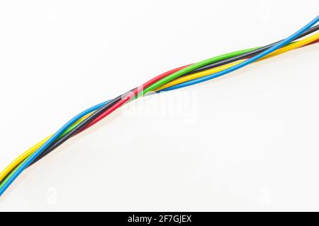 Colored wires, copper wires covered by colored plastic for electrical and technological connections. Cables on white background. Basic colors. Stock Photo