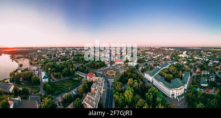 Aerial panoramic view of roundabout road with circular cars in small european city at cloudy autumn day, Kyiv region, Ukraine Stock Photo