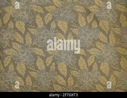 Used floral vintage wallpaper with flowers - natural grainy paper surface and faded colors Stock Photo