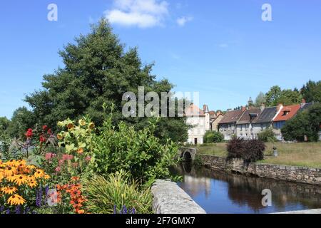 River Creuse at Felletin from Pont Roby with summer flowers, Creuse, Nouvelle-Aquitaine, France Stock Photo