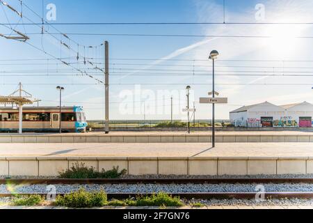 Train and Faro signs on the train station in Algarve, Portugal Stock Photo