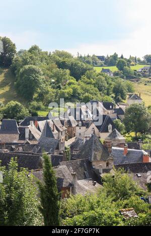 Quaint stone medieval village of  Lower Turenne, Correze, Nouvelle-Aquitaine, France as it straggles down a valley, one of the Plus Beaux Villages de Stock Photo