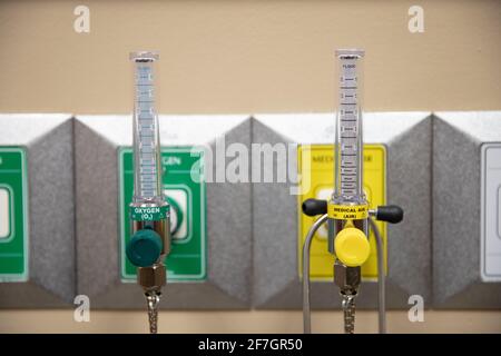 taps for both medical air and oxygen in a hospital room Stock 