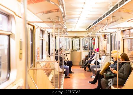 Moscow. Russia. Autumn 2019. People ride in a subway car. Retro train runs on the red line in Moscow. Stock Photo