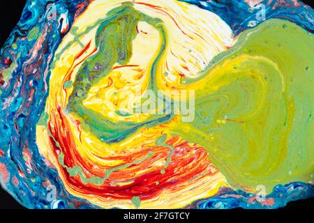 Multicolored marble acrylic background. A smudged spot of various paints covered with sequins. Colorful avant-garde texture. Stock Photo