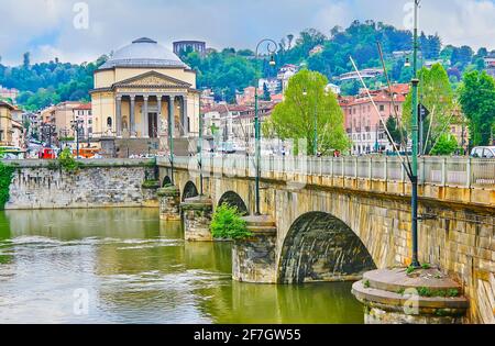 The view of the Vittorio Emanuele I Bridge across the Po River and rotunda Gran Madre di Dio Church, seen on the opposite bank, Turin, Italy Stock Photo